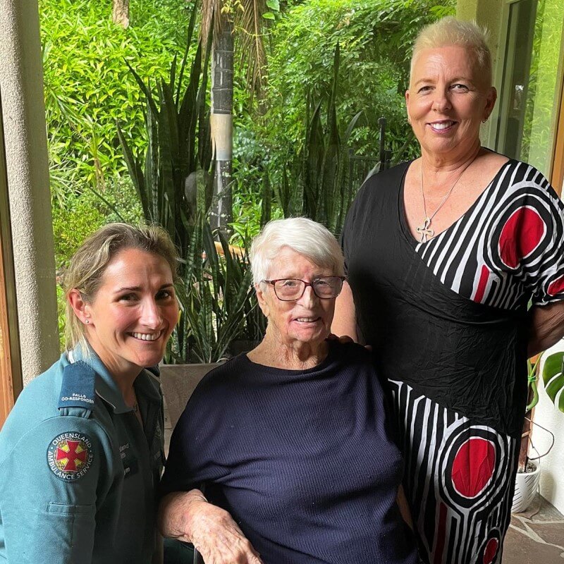 Falls team member with a patient and her daughter