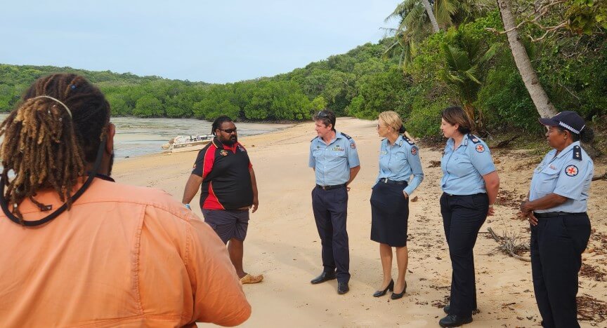 More QAS staff and rangers talk on the beach